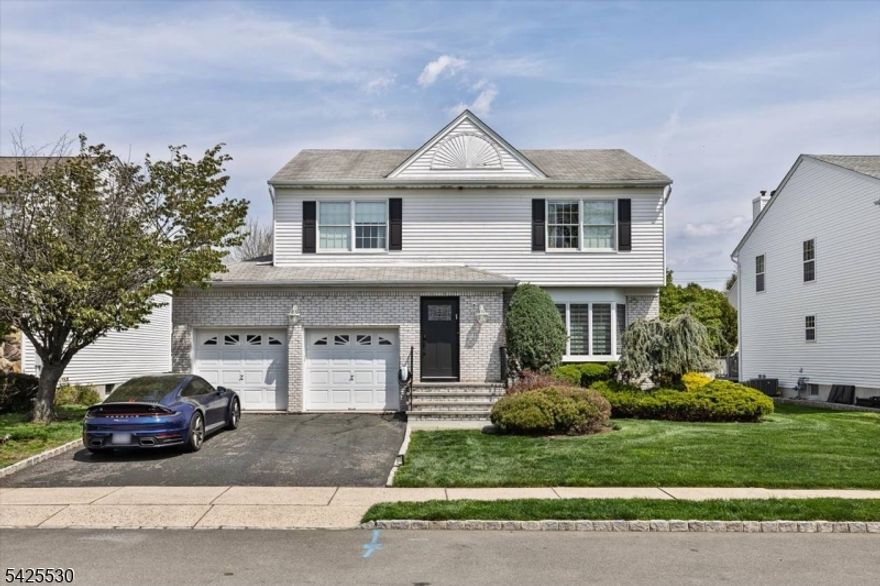 Welcome to the epitome of refined living on a beautiful block! Centrally located on one of the most sought after blocks in Clifton, this home is one-of-a-kind. This exquisite home features a large kosher kitchen, 4 bedrooms, 2.2 baths, and a dedicated office, providing plenty of space and functionality. On the first floor, the large living room provides an inviting space for gatherings and relaxation, while the den offers a cozy retreat for quieter moments. The adjacent dining room, elegant, sets the stage for memorable meals and stylish entertaining. The updated kitchen features all brand new appliances, including a wolf range top, monogram double oven, monogram fridge/freezer, two microwaves, a wine fridge and a dishwasher. Upstairs, step into luxury with a master suite boasting a private bathroom, three closets, and a sitting area. as well as three additional spacious bedrooms and another full bathroom. Descend into luxury in the basement of this home, where you'll discover two additional rooms, a sizable family room, half bathroom, a dedicated office space, and a practical laundry room. The attached 2-car garage offers convenience, while the spacious backyard with a deck invites outdoor relaxation and entertainment. With ample living space and thoughtful design, as well as central air and updated mechanics this residence promises a lifestyle of comfort and sophistication.  Seize the opportunity to call this gem your home!