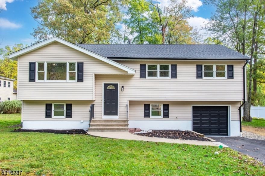 Stunning Renovation! This spacious 4 bedroom, 2 full bath home has been completely updated from top to bottom! Upon entry, you will notice the gleaming hardwood floors with modern darker tone and tons of natural light throughout. The open floor plan leading to the chef's kitchen is complete with large center island, gorgeous tumbled granite & stainless appliances, perfect for casual dining or entertaining! Updated two full bathrooms also showcasing modern trends for a fresh new look. Lower level offers, family room, one spacious bedroom, full updated bath with shower, wood burning fireplace and sliders to a brand new patio and private level yard! Additionally, this home offers brand new furnace, hot water heater and roof to minimize any repair worries! Public sewer, water, & natural gas. This home is situated in a neighborhood setting with cul-de-sac. Washington township is also know for their highly ranked school system. Come see and make this your forever home today!