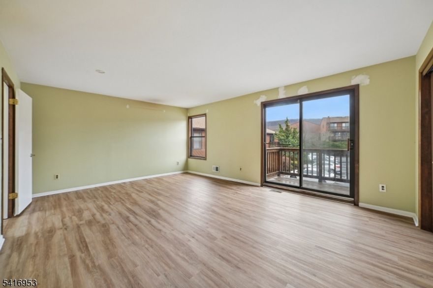 Brookside Heights 2 bedroom interior unit multi-level townhome.  This unit boasts an updated kitchen, Powder room,  Formal Dining Room & Living Room with wood-burning Fireplace & slider to good sized deck w gas grill (INCLUDED).  2nd floor offering 2 bedrooms, newer laminate flooring.  Primary bedroom with Deck, double closets, jetted tub, Bathroom with double sink and shower .  Plus large linen closet.  Main Bath has tub/shower with additional Linen Closet.  2nd bedroom offering additional deck, double closets.  Basement has large Family room, part tile & Part carpeted with slider to outdoors.  Laundry/Utility room with some storage cabinets, washer/Dryer.  This home is being sold in as is condition, inspections for informational purposes only.  2 assigned parking spaces come with the unit Labeled 1F.   Close proximity to Lakeland High School.