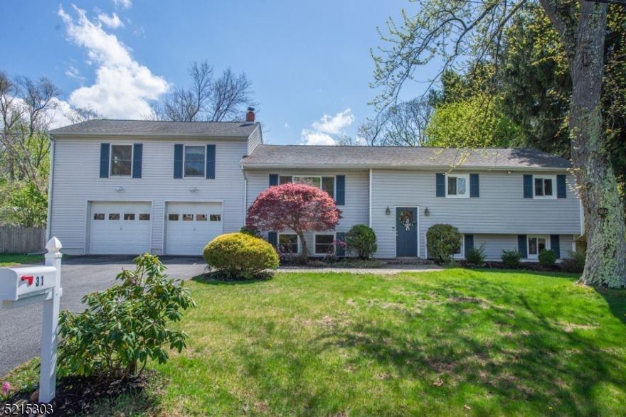 Bright & Sunny Expanded Bi-Level in a quiet residential Fernbrook neighborhood! This home boasts a large primary suite addition with full bath and walk-in closet. Three additional generous sized bedrooms on the main level and full bath. Updated kitchen with slider to composite deck and backyard, dining room and living room complete this level. The lower level has a Den with a wood burning stove, a large Great Room with built in bar and walk-out door to backyard. A full bath, and a large laundry/storage room with entrance to the 2 car garage. The fenced-in flat backyard is expansive and private and offers great recreational opportunities and plenty of space for entertaining.  A 12x26 shed offers lots of space for storage. Public utilities. Award winning Randolph schools. Close to shopping, restaurants and major highways for commuting. Walk to beautiful Hedden County Park, a 420 acre outdoor oasis. Two miles to Dover Train Station with direct trains to NYC. Don't miss this great home!