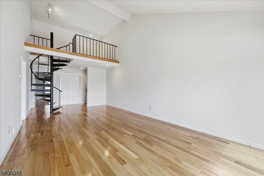 Sunny spacious condooffers a solid layout and excellent potential for buyers looking to personalize their next home.  Offering living room/dining room combination with cathedral ceiling, sunroom, open porch, eat-in kitchen, primary suite with bathroom and walk in closet, 2nd bedroom with access to porch, second level offers loft overlooking the living/dining room plus roomy storage closet and utility room. Separate basement storage and attached garage. Close to NY trains, highways, schools, shopping and parks.This property presents a rare opportunity to add value and design to your taste. Ideal for homeowners seeking a project or investors looking to enhance and resell, this property is priced to reflect its condition and potential.