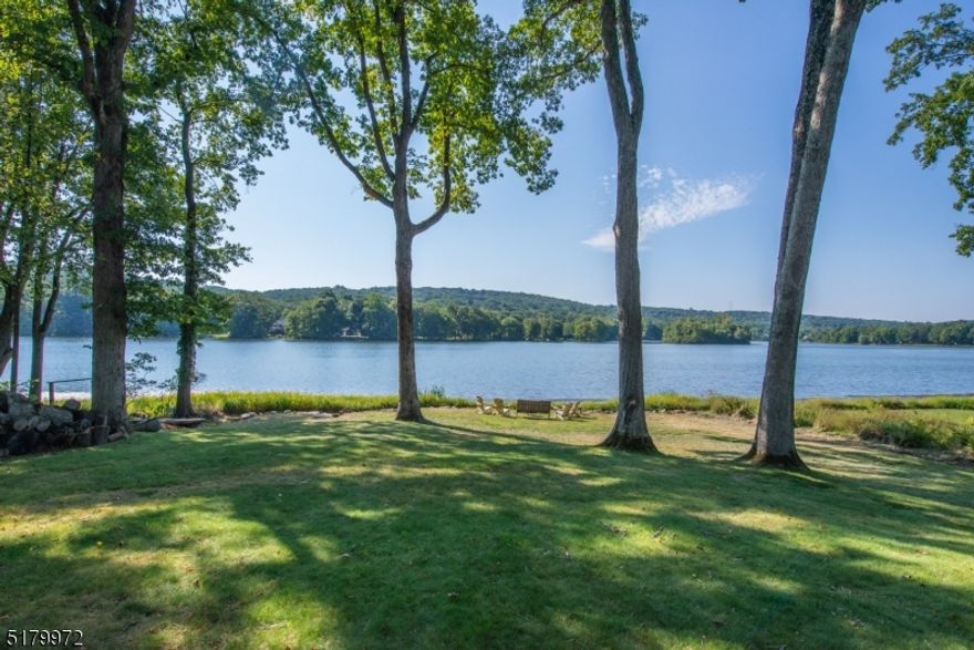 Location, Location, Location! One of the best lots in Shongum Lake with unobstructed wide views of the lake and beach. Enjoy Lake living at it's best! The home features a spacious main floor with Foyer, Powder Room, Living Room with Fireplace, Dining Room with Pocket Doors, Laundry room, Kitchen open to Family Room with door to the deck, and big windows overlooking the lake! A second fire place in the Family Room! A large Primary Bedroom w/ 3 large closets, a second bedroom, and a brand new (2020) full Bath. Ideal floor plan for ONE FLOOR LIVING! The second floor offers 2 additional bedrooms, a full bath, and an unfinished room with lot's of potential! The basement offers a 2 car garage, and two unfinished large spaces with lot's of potential for additional living space! New Septic in 2009! The Shongum Lake Community features a clubhouse, beach, boating, swimming, and a full calendar of social events. Begin living a resort like lifestyle today! Amazing opportunity to update and make it your own!