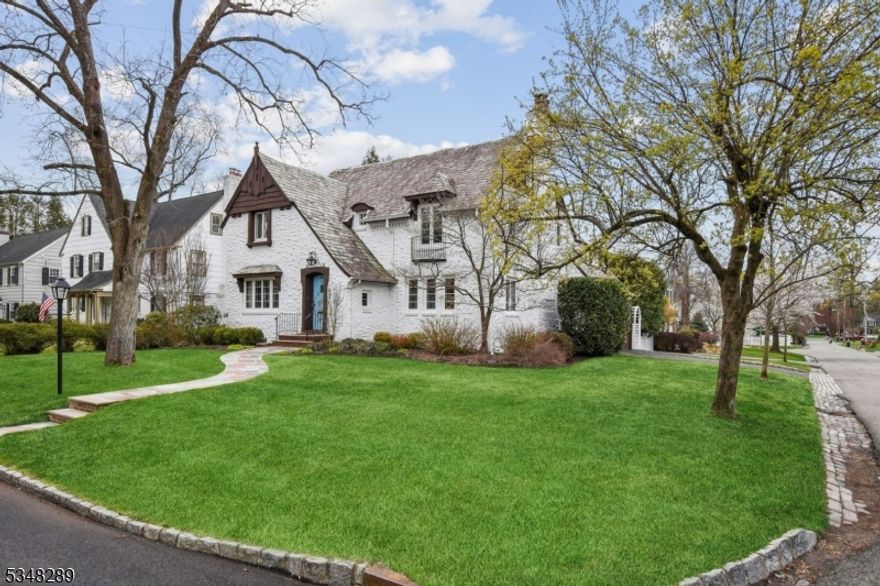 This meticulously maintained, spacious and bright Tudor is located in the heart of Glenwood. The home features four large bedrooms (all on the second floor), 2 full/1 half renovated bathrooms and a lovely updated kitchen with an adjoining breakfast room. Off of bedroom 3, there is the potential to add a balcony/sunroom. There is a two-car attached garage, which opens into a light filled office/den, and a flat, fully fenced in private backyard with a stone patio. The basement has a finished rec room as well as a large storage and laundry area. From the moment you arrive, you will be drawn in by the home's character and curb appeal. Original features have been thoughtfully preserved, showcasing rich craftsmanship throughout.