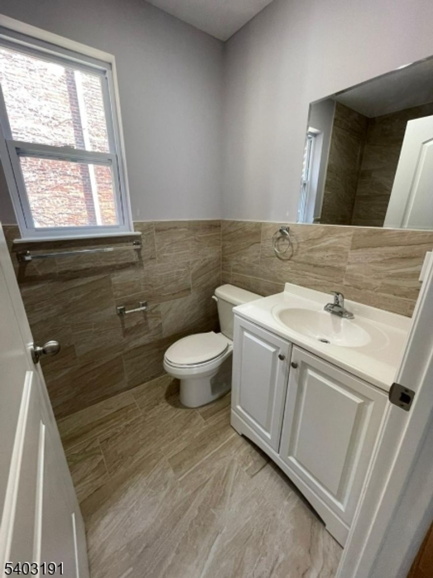 Welcome to 201 Schuyler Ave, Unit 2, Newark NJ. Built in 2021, this beautifully maintained and newly repainted apartment comes with all the bells and whistles of modern living.  The open concept is complemented by hardwood and tile flooring, central air and forced air heating for year-round comfort. The spacious apartment features 3 large bedrooms and 2 full bathrooms. The modern kitchen is fully equipped with upgraded appliances including dishwasher, stove, microwave and refrigerator and convenient in unit laundry. Located near Beth Israel Hospital, this property offers easy access to public transportation, major highways and shopping.