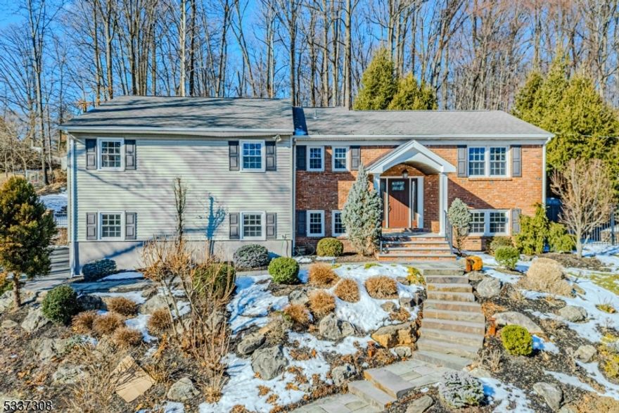 Immaculate, Bright Custom Bi-Level. Quality craftsmanship and fine detailing throughout. Situated on an expansive lot, in a quiet Neighborhood. Gorgeous bluestone hardscape welcomes you in. Lots of Generous Room Sizes to Spread Out & Make Your Own! Layout offers versatile options! GREAT house for entertaining or everyday living. Large living room w/big picture window offers tons of natural light. Recently renovated custom kitchen. Granite countertops, maple cabinets, stainless steel appliances, gas cooking & separate dining area. 4 large bedrooms & 2 full bath upstairs includes the primary suite w/bath & walk-in. 2 additional bedrooms and bath on lower level offers more room for guest or multigenerational living. Fully equipped w/an optional exercise room or office & laundry/mudroom. An oversized family room w/projector & screen adds to the fun and functionality. Over 3100 square feet. 2 car garage. The property offers breathtaking gardens and an amazing backyard, fully fenced with a patio & deck. Low voltage exterior lighting for ambiance. Underground irrigation system. Enjoy a game of basketball on your private sports court. Tons of parking! Almost a full acre. An ideal spot to relax & enjoy life. Both gutters & roofs have a heated de-icing system.  Just a short walk to Downtown Morris Plains & NYC Direct Train Station. Or a short drive to Morristown Green, Dwtn Denville, tons of shopping and restaurants! Easy access to major highways such as 80, 10, 46 & 287.
