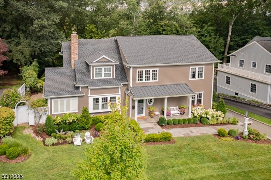 Don't miss this gorgeous Colonial in Madison's most sought after Cross Gates neighborhood!  This stunning 5 BR, 4 Full and 2 Half bath home sits on a private, beautifully landscaped .44 acre lot and boasts high ceilings, detailed moldings, and hard wood floors throughout.  The first floor has a welcoming floor plan that flows beautifully for entertaining.  The large kitchen with high end appliances, huge island, beverage fridge and breakfast nook opens to spacious family room with fireplace and has French doors out to rear deck overlooking landscaped yard and patio.  First floor also has a formal living room with fireplace, private office, formal dining room, powder room, laundry room and large private guest suite with full bath.  The open stairway leads you to the second floor containing a primary suite with luxury bathroom and 2 large closets.  Three other bedrooms, 1 en suite and 2 sharing a jack and jill bath, complete the second floor.  The bright walkout basement has a mud room, a play room, a huge rec room, an exercise room,a gorgeous wine room and an entrance out to large private backyard with swing set and blacktop for bikes and basketballs.  All of this is just minutes away from Madison's charming downtown restaurants, schools and NYC trains!  This home is not to be missed.