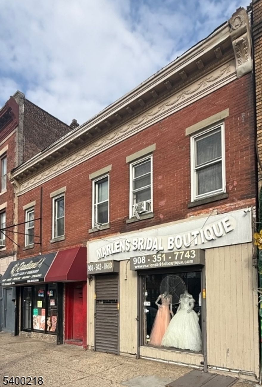 LOOKING FOR A PROPERTY THAT CHECKS THE "LOCATION VISIBILITY, AND INCOME POTENTIAL" BOXES ALL AT ONCE? THIS MIXED-USE BUILDING ON BUSTLING ELIZABETH AVE IN ELIZABETH, NJ IS EXACTLY THAT. WITH TWO STOREFRONTS ON THE FIRST FLOOR AND TWO APARTMENTS UPSTAIRS, IT'S A FLEXIBLE INVESTMENT THAT PUTS YOU RIGHT IN THE CENTER OF NONSTOP FOOT AND VEHICLE TRAFFIC. YES, THE BUILDING NEED SOME TLC, BUT THE BIG-TICKET ITEMS ARE ALREADY HANDLED NEWER ROOF, NEARLY NEW WATER HEATERS. SEPARATE UTILITIES (WITH THE EXCEPTION OF THE HEAT BETWEEN THE STORES) THAT MEANS YOU CAN FOCUS ON THE UPDATES THAT BOOST VALUE INSTEAD OF THE COSTLY REPAIRS NO ONE LIKES TO TALK ABOUT. ON THE FIRST FLOOR, YOU'LL FIND HIGH-VISIBILITY COMMERCIAL SPACES PERFECT FOR RETAIL, SERVICE BUSINESSES, OR FUTURE TENANTS WITH BIG IDEAS. UPSTAIRS ARE TWO RESIDENTIAL UNITS, BOTH ON MONTH TO MONTH LEASES, GIVING INVESTORS THE FLEXIBILITY TO RAISE RENTS, RENOVATE, OR REPOSITION BASED ON THEIR STRATEGY. IF YOU'RE AN INVESTOR LOOKING FOR A PROPERTY WITH STRONG UPSIDE, GREAT EXPOSURE, AND BUILT-IN INCOME FROM DAY ONE-THIS IS THE OPPORTUNITY. REPAIRS DONE BTW 2022-2024 HEATING, WATER HEATERS, ROOFS, ELECTRICAL CIRCUITS, AND OTHER COSMETICS REPAIRS.