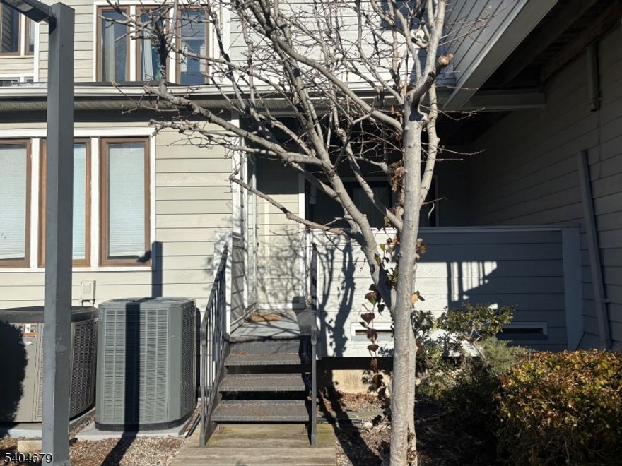 Beautifully upgraded one-bedroom rental in Harmon Cove IV townhomes. Features include a modern kitchen with quartz countertops, coffee cabinetry, and Pfister faucet; updated bathroom with marble shower and smart mirror; hardwood floors throughout; wood-burning fireplace; three skylights; and recessed lighting with dimmers. Private rear deck overlooks community pool. One assigned parking space. All appliances included. Convenient NYC transit access. No smoking of any kind. No pets.