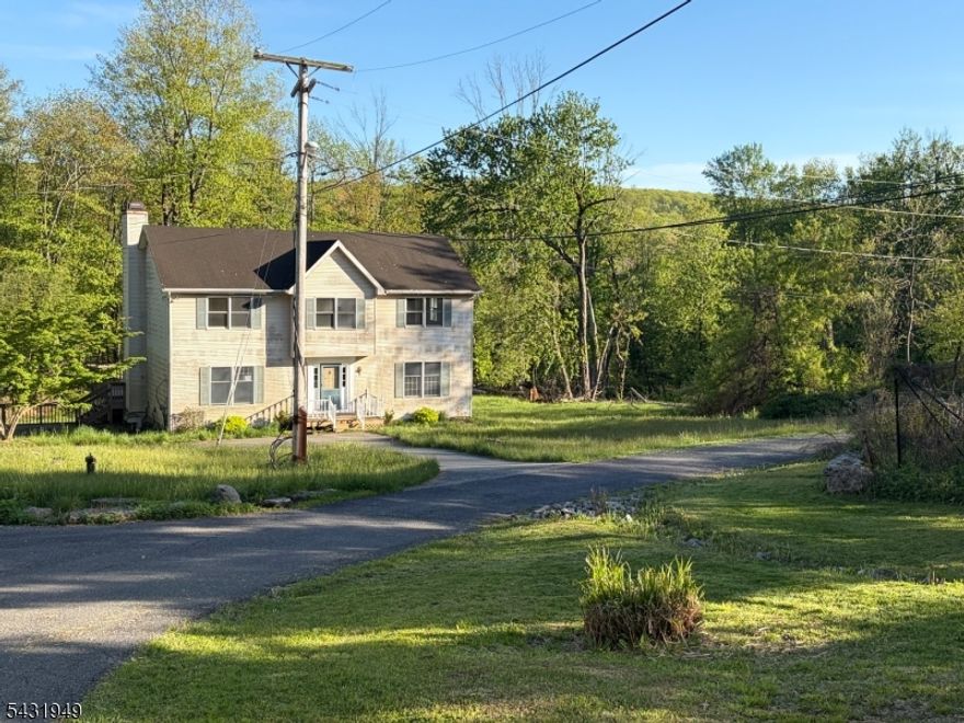 Endless potential awaits in this spacious home situated on 3+ rolling acres in Independence Township. Generous room sizes, scenic setting, and flexible layout create an excellent opportunity to restore and customize. Sold as is. Buyer is responsible for all inspections and due diligence.