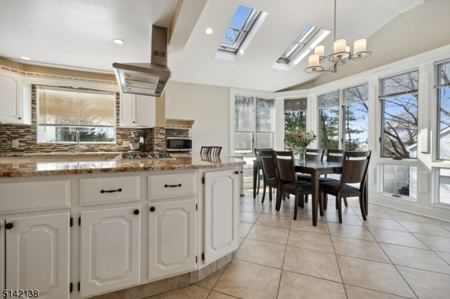 *** MULTIPLE OFFERS** Highest & Best by Tuesday 4/19 5PM. Recently renovated this Colonial style home boasts 3BD 31/2BTH, a 2-car detached garage & a finished basement offering mother/daughter potential. This recently renovated home features bamboo floors, an updated kitchen, skylights & lots of natural light. The foyer with a powder room opens to a large, bright LR w/a wall of windows. The gorgeous eat-in kitchen is appointed w/granite counters, stylish tile backsplash, extensive & elegant white cabinetry & SS appliances. The kitchen is open to the dining area awash w/light from skylights in the vaulted ceiling & a bank of floor-to-ceiling windows bringing the outside in. From the dining area or the adjoining FR, step outside to the large deck overlooking the manicured back yard. The office could be used as a first floor guest bedroom.The second floor encompasses the Primary BD suite w/a skylight, double closets, an office nook, & a private BTH with a jetted tub & separate shower. 2 additional bedrooms & a full hallway BTH complete this level. The finished basement level could easily be converted to an in-law suite including a spacious rec-room, a full bathroom, kitchenette & a separate outdoor entrance.Manicured front and back yards & an extra-wide driveway for plenty of parking space complete the package of this impeccable, move-in ready home!