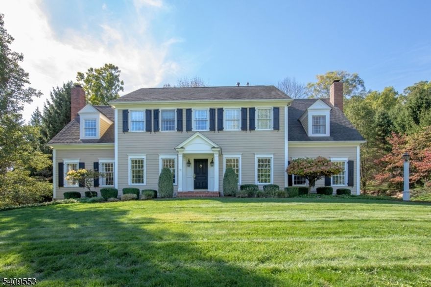 Set on an acre and a half in Mendham's sought-after Brookrace neighborhood, this elegant Colonial has exceptional curb appeal, a bright interior, high ceilings and quality updates. Five en-suite bedrooms, four full and two half baths, hardwood floors, two gas fireplaces, custom millwork, and built-ins. Main level includes a spacious foyer, living room with fireplace, formal dining room, and family room with built-in media center, another gas fireplace and a back staircase. Custom chef's kitchen with oversized island, granite countertops, premium cabinetry, professional-grade appliances, two dishwashers and an adjoining breakfast room overlooking a private patio. Powder room and laundry complete the first floor. Upstairs, the primary suite features walk-in closet and a spa-inspired bath with heated marble floors, soaking tub, quartz counters, and ample storage. Additional en-suite bedrooms provide flexible guest or office space. Finished walkout lower level includes a media area, billiards space, custom bar with wine storage, exercise room, and powder room. Outdoor living features a stone patio with wood-burning fire-pit, professionally landscaped grounds with an in-ground pool surrounded by mature trees. Direct access to Schiff Nature Preserve and Lake Therese, offering boating and fishing for Brookrace residents.  Top-rated Mendham Township schools.  Three-car garage, whole-house generator, central vacuum, security system, wireless irrigation, and public utilities.