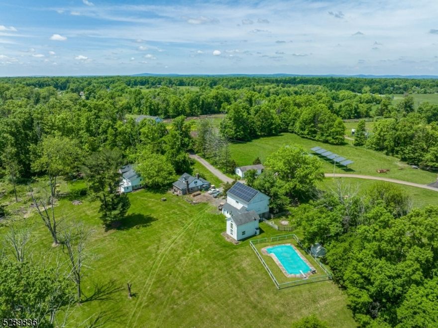 Welcome to Kleinhans Farm! This SPECTACULAR 150 ACRE COUNTRY ESTATE features a meticulously renovated Circa 1790 stone & clapboard colonial overlooking a scenic stream-fed pond. A stone fireplace, beamed ceilings, exposed stone walls & deep-set windows are among the authentic features retained in this thoughtfully updated 3 BR, 3 BA home.  There's also a spacious 2 BR, 1.5 BA stone guest cottage, 2 story studio loft apartment, inground pool, multiple barns with a substantial number of horse stalls, extensive paddocks, expansive fenced pastures & magnificent hay fields! ALL DWELLINGS ARE SUBSTANTIALLY SET BACK FROM THE ROAD, OFFERING UNCOMPROMISED PRIVACY.  An added bonus are the extensive solar panels, generating free electricity, that are owned by the seller and included in the sale. This working farm currently has 30 Belted Galaway cattle + sheep, lamb, chickens & retired race-horses. This exceptional homestead RETAINS FULL DEVELOPMENT RIGHTS (NOT farmland preserved), boasts extensive road frontage and adjoins an equally impressive 75 Acre country estate which is also available for purchase. Very rarely, perhaps once in a lifetime, is there an opportunity to acquire a property of this magnitude & splendor! NOTE- Sale of property was modified to include a 36-acre tract of land that was added to the 150-acre farm = total of 186 acres. (36-acre tract had previously been included as part of 289 Locktown Road listing package)