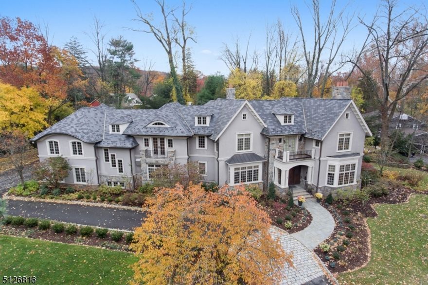 Sophisticated 6 bedroom, 5 full & 3 half bath residence residence, in a premier location on a park like 0.68 acre property. This sensational residence was painstakingly custom built for the owners & has the finest amenities for utmost comfort & luxury. Spectacular, front to back foyer with an unique, one-of-a-kind floating staircase & unique 3 story windows that go from the walkout lower level to the second floor! Stunning library, state of the art gourmet kitchen, off the oversized family room with a wall of windows2 offices, gym, elevator, tastefully finished large lower level with a state-of-the-art home theater, game room/billiard room, extraordinary custom entertainment area with a wet bar, bedroom suite with full bath pus a powder room & kitchen are some of the desirable features