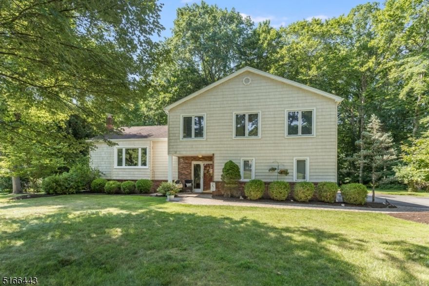 Pride in homeownership in this beautiful 4 bedroom, 2.5 bath Split Level with attached 2 car garage in a quiet Cul-de-sac! Walk the newer paver walkway to the front door. Enter into a welcoming foyer that opens to a sun-drenched living room & dining room with newer windows throughout and gleaming hardwood floors. Kitchen has been upgraded with stainless steel appliances and has great natural light through slider door to deck Spacious new deck (2020) with natural gas line for BBQ and large, park-like level backyard are great for entertaining.  Large family room anchored with stone around wood burning fireplace & sliders leading out to paver patio.  Laundry & powder room conveniently located on ground floor finish out this level.  Second floor features hardwood floors down hallway, large master en suite with closet, 3 additional spacious bedrooms & hall bath. The basement is a large space currently used for utilities and storage yet has endless possibilities.  Home sits on over 1/2 of an acre with mature landscaping. Home also features gutter guards, whole house attic fan, natural gas, public water, and public sewer. Located in the Succasunna section of Roxbury Twp. with close proximity to Rt 10, Rt 46, Rt 206 and Rt 80, train in Mount Arlington or Netcong, shopping, dining and highly rated schools. Welcome home!