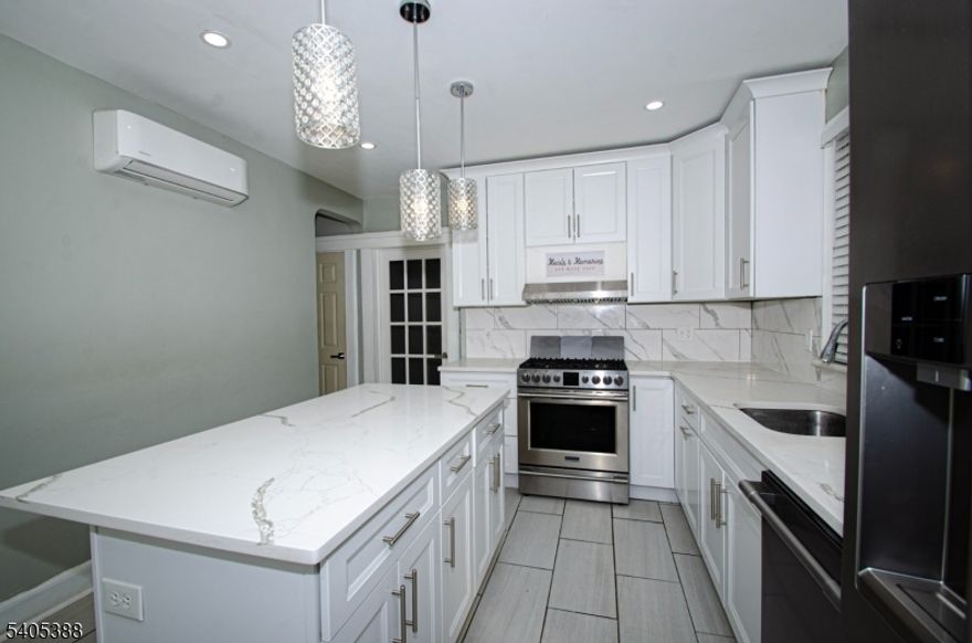 This charming, freshly updated first-floor apartment in South-Paterson offers two good size bedrooms, a separate living room, formal dining room, and a modern eat-in kitchen. The home features beautiful hardwood floors throughout, abundant natural light that makes the space feel bright and airy, and a full bathroom. The updated-kitchen is a true highlight, boasting sleek quartz countertops, a convenient kitchen island, stainless steel appliances including a refrigerator, dishwasher, and stove/oven with range hood extractor, plus ample pantry storage. Ideally located close to shops, eateries, houses of worship, public transportation, and major bus routes, this move-in-ready gem provides comfort, style, and unbeatable convenience with a one (1) car parking space included in the lease. No use of Basement, back-yard or patio.