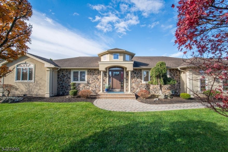 Exceptionally designed Ranch with stunning style, both inside & out, & resort-style living, delivering everything you?ve been waiting for. Incredible newer features include: impressive open floor plan with 2 story sun filled foyer, beautiful dining room with cathedral ceilings & built-in bar, gourmet chef kitchen with high end appliances, Crawford ceiling & oversized center island leading to great room with soaring ceilings, fireplace & breakfast eating area. Primary suite boasts entry foyer, 2 custom walk-in closets, spa owner's bathroom with custom vanity, soaking tub & stall shower. Two additional bedrooms, huge newer bathroom with jetted tub & a conveniently located laundry room. Lower-level features multiple rec rooms with newer secondary kitchen & half bath, great space for all your lifestyle needs. Enjoy the outdoors with your private resort: saltwater pool, waterfall, electric awning, beautiful paver patio, & pool house. Bask in the sun for a fun weekend with your friends or just a quiet day relaxing at home. Additional features: custom window treatments & moldings, professional landscaping, skylights, multiple wine refrigerators, oversized 2 car garage, paver walkways & driveway, recessed lighting, hardwood floors throughout, tons of natural light, & beautiful windows. Great location. Top rated school system. Minutes to shopping, restaurants, town activities, Whole Foods, Trader Joe's, & NJ Transit Bus & Train Center. This home is the definition of perfection!