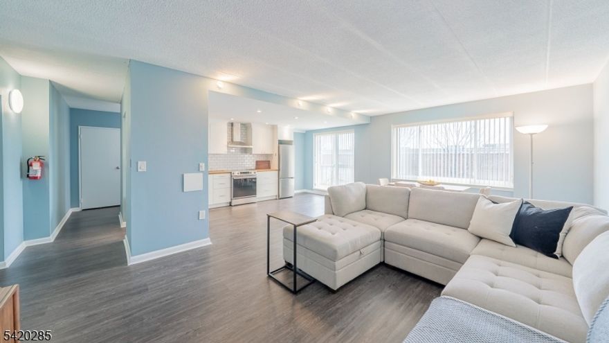 Enjoy easy, low-maintenance living in this newly renovated light-filled 1-bedroom condo with an open-concept layout designed for today's lifestyle. The kitchen with white cabinets, stainless steel appliances, subway tile backsplash, living room, and dining areas flow effortlessly together, with sliders opening to a private balcony ideal for unwinding or entertaining. The generously sized bedroom features two walk-in closets for exceptional storage. Updated with all new appliances, new water heater, CAC, huge 5' x 13' storage unit, new roof and located in a convenient elevator building just moments from shops, dining, community pool and more. Easy commute to NYC. Low HOA. Don't miss this opportunity.