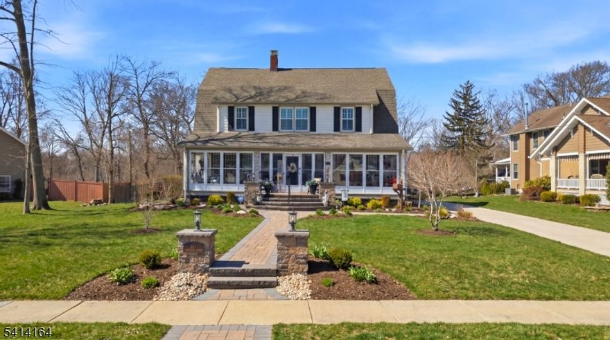 Set in desirable Beechwood Heights, expanded & exquisitely updated Colonial blends timeless charm w/ modern luxury + a true staycation backyard. Curb appeal shines w/ paver path to enclosed front porch; French doors open to foyer w/ hardwood flrs, wainscoting, chair rail & shiplap ceiling. Formal LR w/ crown molding & stone-front gas FP (marble hearth/wood mantle). FR w/ hardwoods, retractable fan & picture window. Stunning 2021 DR addition features LVP, plantation shutters, French doors & rain-sensor skylight. Custom laundry rm w/ waterproof vinyl, barn door & side exit; separate pantry rm w/ LVP, extensive cabs/drawers, shiplap backsplash & skylight. 2021 chef's kitchen: gray shaker soft-close cabs, rollouts, quartz, copper farm sink, hot water disp. & disposal, recessed/under-cab/display lighting, oversized island w/ drawers, breakfast bar, pendants, microwave drawer, SS appls & pop-up power w/ USB. Updated 1st-flr full bath. Double French doors to fully fenced oasis: paver porch + patios, built-in firepit seating, IG pool w/ fiber-optic lighting & new pump, pool house w/ tiki bar, electric, lighting, fan & TV-ready setup. Upstairs loft + 4 BRs; primary w/ WIC. Remodeled hall bath w/ marble-top vanity, soaking tub & luxe glass shower (rain head). Walk-up 3rd-flr bonus space. 1 mi to Bound Brook train, 0.5 mi to bus, close to major hwys.