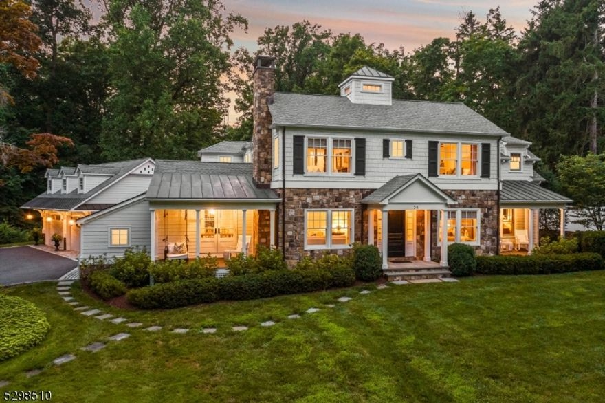 An extraordinary home sited on the gentle bend of one of Basking Ridge's most esteemed streets. On a gorgeous 2 acre lot, this home showcases the trademark style and quality of Scandic Builders. The generous chef-caliber kitchen featuring marble countertops, a large center island, Viking appliances, striking light fixtures and built-in breakfast seating opens to the chic and inviting family room with coffered ceilings, floor to ceiling built-ins, walls of windows and an oversized fireplace. The handsome den is available for your intimate gatherings. Both the family room and the den enjoy french-doors opening to the expansive bluestone patio with a built-in grill/entertaining station, gas fire-pit, and a stone knee-wall border. Enjoy moments on one of the three covered porches. Two staircases ascend to the upper level where there is a primary suite with multiple walk-in closets and an elegant bath with radiant heat floors, an over sized shower and a free standing tub. There are two additional bedrooms with en-suite baths. The fourth bedroom is on the first level. The attention to detail is limitless: extensive millwork, wainscoting, coffered ceilings, slate countertops, marble countertops, large picture windows, deep window sills, cabinetry style closets and custom built-ins. Natural beauty, small-town warmth, excellent schools and accessibility to NYC make this a location of choice! Detailed feature sheet is available.