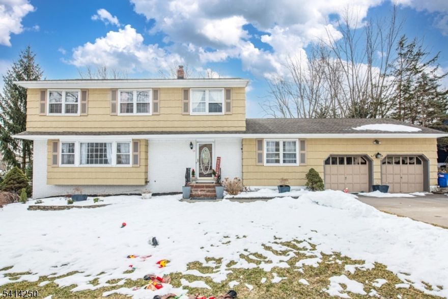 Welcome home to this beautifully maintained 4 bedroom, 3 full bath Colonial. Inviting foyer with hardwood floors and French doors leading to the 24x14 living room. Refinished, gleaming hardwood floors and abundant windows fill the home with natural light. Formal dining room is perfect for entertaining and special occasions. Spacious eat-in kitchen with sliders to a two-tier deck ideal for outdoor dining and gatherings. Family room features brand-new carpeting, creating a warm and cozy space to relax. Second level offers a primary suite with full bath, plus three additional bedrooms and another full bath. Finished basement provides rec room and bonus space. Large backyard with shed. Central air. Conveniently located near schools and shopping.