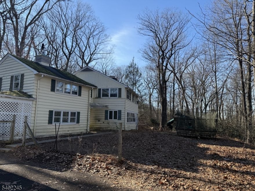 Welcome to a rare opportunity in the heart of Basking Ridge. Set on one of the largest lots in the area at approximately 1.94 acres, this 2,838 sq ft Colonial offers exceptional potential for the right buyer.This property is ideal for contractors, builders, or buyers with vision. The home is in need of significant renovation, but the upside is undeniable given the size of the lot, the neighborhood, and the location.The existing structure offers a flexible layout with 4 bedrooms and 3 full baths, providing a solid footprint whether you choose to renovate, expand, or start fresh with a custom build. The lot itself is a standout offering privacy, scale, and long-term value that is increasingly hard to find in Basking Ridge. Located in a highly desirable area known for its excellent schools.  Just 3 blocks form Ridge High School, this property combines space, location, and opportunity. Renovate the existing home or build new the choice is yours, and the possibilities are substantial.