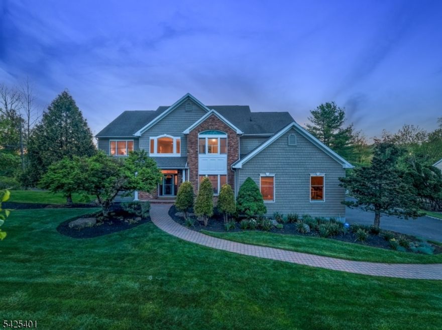 RESORT-LIKE COLONIAL IN HIGHLY DESIRABLE WESTFIELD IS MADE FOR STAYCATIONS! Welcome to 2 Trails End, an address that perfectly illustrates the quiet beauty of this park-like property spanning almost an acre at the top of Prospect St, with a direct 1.5 mile path into charming downtown Westfield. Enter the home via a double-height foyer with grand staircase to discover hardware floors throughout, tall windows, incredible closet space & a great flow. Bright Living & Dining Rooms span the left side leading to spacious Eat-in Kitchen & Family Room with cozy gas fireplace. Kitchen boasts wood cabinetry, granite countertops, center island with gas cooktop, SS appliances including double wall oven, & beverage bar with fridge. Breakfast Nook sits in a bay window with sliders to large composite deck overlooking backyard. A professional fenced-in Tennis Court is the star here, perfect for all sorts of sports & activities, along with paver stone patio & ample lush grass lawn. Office, Powder Room & Laundry Room to Attached 2-car Garage complete this level. Upstairs has expansive Primary Suite with vaulted ceilings & windows on 3 sides, 2 closets & Bathroom with double vanity, dressing table, large walk-in shower & Jacuzzi tub. 3 more spacious bedrooms & tons of closets ensure there's room for all. Lower Level has even more space with 5th Bedroom, Full Bath, Wine Cellar & immense Rec Room with wet bar & access to backyard oasis. Beloved Franklin & Roosevelt schools are icing on the cake!