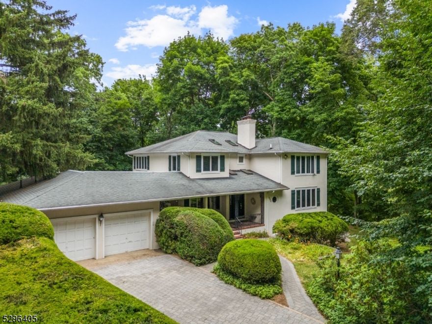 Nestled at the end of one of Ridgewood's most desirable streets, lies a magical waterfront home with Guest Cottage & beautiful views. Surrounded by perennial mature plantings overlooking the Hohokus brook, this bespoke light drenched colonial lets the outside in with hallway skylights and large windows throughout. Set on a .63 acre with the outsized deck for easy entertaining, it has room for a pool, vegetable garden and/or a wildflower meadow. Inside BOAsts generous room sizes & an open floor plan. Lovely lower-level walk out space with its own BR/bath has separate entrance and leads to a private stone patio with the sound of running water. A special Guest Cottage with its own kitchen and bath is perfect for additional guests, home office and more and truly sets this house apart. Spectacular private oasis in the heart of Somerville, close to schools, NYC train and downtown.