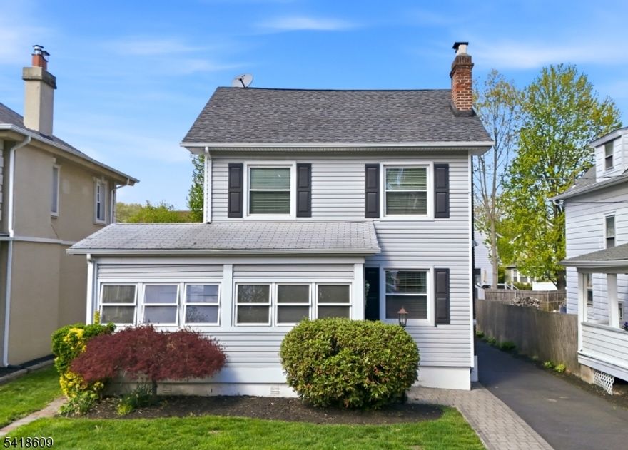 Set on a quiet, tree-lined street bordering Glen Ridge, this lovingly maintained Colonial offers three levels of living, plus an unfinished basement and two-car garage blending classic functionality and neighborly vibes. Enter from the sun-filled enclosed porch into a gracious living room with a gas fireplace and formal dining room. Chefs, prepare your meal in the updated kitchen featuring granite countertops, stainless steel appliances, and a center island designed for crafting recipes. The bonus room off the kitchen adds flexibility, with sliding doors opening to a two-tier deck and charming backyard, perfect for entertaining or relaxing. Complementing the backyard is a two-car garage located at the end of the driveway. The second floor features three bedrooms and a full bath, with stairs leading to a finished third level ideal as a primary suite with a walk-in closet and full bathroom. Additional space includes an unfinished basement with laundry, storage, and French drains plus sump pump. Blending suburban charm with city accessibility, this home is ideally located near major highways and two walkable train stations, offering access to NYC or Hoboken in less than 30 mins. or Downtown Montclair in 10 mins. 65 Carteret is positioned between Watsessing and Carteret Parks, and doors from local favorites like 23 Skiddoo, Jed's Bread, and Narda's. Your next chapter starts here. Property, fireplace, chimney, and flue conveyed as-is with no known issues.