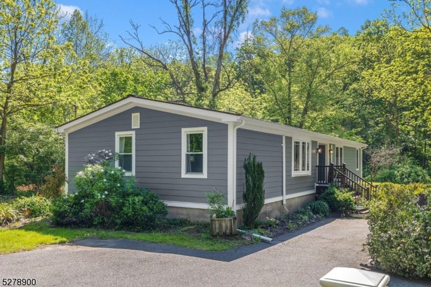 A farmhouse-inspired, bright country home and fisherman's paradise awaits the discerning buyer! This 3 Bedroom, 2 Bath ranch sits right on the Musconetcong River with a lovely backyard perfect for relaxing, observing the endless wildlife and fishing! This truly move-in ready, fully re-done home boasts high-end finishes including a large, brand-new high-end luxury kitchen with quartz countertops, generous pantries AND new appliances. New Mohawk wood floors installed throughout the house, new James Hardie Board siding, all-new plumbing and fixtures, new gas fireplace (furnace-rated), insulation, drywall, newer roof, new rear steps/storm door and split-ductless AC Units. The primary bedroom suite features two custom closets with a new ensuite bath, dual vanity and curb-less, walk-in shower. Generous, private guest bedrooms with custom closets are just steps away from the gorgeous new bath. The entire home has been pre-wired with surround sound audio and ethernet, ready for today's technology! This property will be a joy to tele-commute from, listen to music or an audiobook while entertaining, cleaning, or relaxing on a day off! The entire home has been renovated from top to bottom with care & consideration for the new buyer. There's nothing left to do but move in! New 3 bed septic. Located near great shopping, restaurants, RTE 80 & RTE 46, to ensure an easy commute.