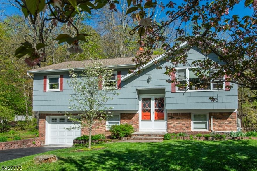 Welcome to this meticulously maintained bi-level home, perfectly situated on a beautiful, level lot that backs to serene woods offering exceptional privacy and a peaceful, park-like setting. This well-cared-for home features 3 spacious bedrooms with the potential for a 4th, along with 1.5 bathrooms. Lovingly maintained for nearly 40 years, this property is being offered for sale for the very first time. A rare opportunity you won't want to miss. Step outside and fall in love with the truly magical, dream-like backyard. Whether you're entertaining, relaxing, or simply enjoying nature, this stunning outdoor space is sure to impress. Inside, you'll find hardwood flooring, a bright and functional layout, and numerous upgrades including a newer septic system (installed within the last 5 years), a brand-new roof (October), an above-ground Roth oil tank, and a mini-split system to keep you cool and comfortable. This is a home that combines charm, care, and important updates, all set in a picturesque and private setting. Don't wait to schedule your showing today!