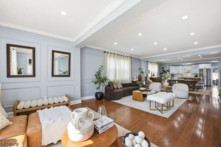 Welcome Home!!! This beautifully renovated and move-in ready  4-bedroom, 3.5-bathroom home offers modern upgrades and thoughtful design throughout. Featuring hardwood flooring throughout, the home showcases a stunning kitchen with new cabinetry, granite countertops, center island, and stainless steel appliances perfect for both everyday living and entertaining.Enjoy peace of mind with major upgrades including new siding, roof, windows, and driveway, along with two new central A/C systems. All bathrooms have been fully renovated with stylish finishes, and the finished basement provides additional living space ideal for a recreation area, home office, or guest suite.Located in desirable Hasbrouck Heights, this home offers the perfect blend of comfort, style, and convenience. Great for NYC commuters and top rated school system!!