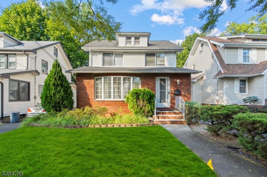 Charming 3 bedroom 1.5 bath colonial in a prime location.   This home offers hardwood floors throughout, large living room, formal dining room with sliding glass doors to a three season porch, 1 car detached garage, full unfinished basement and walk up attic.   Make this home your own.