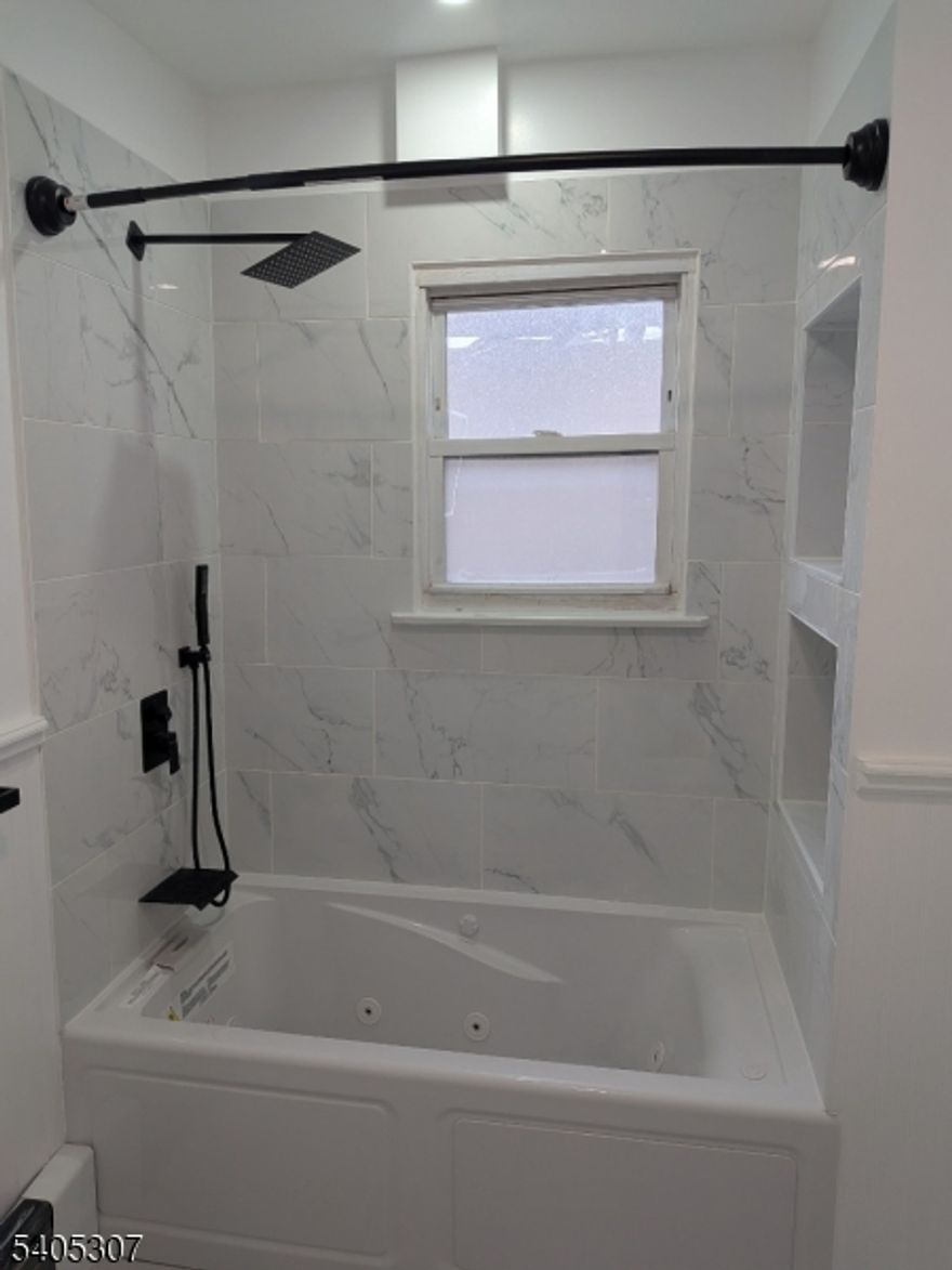 Experience bespoke luxury living in this beautifully appointed two-bedroom, one-bath apartment in East Orange, ideal for anyone seeking elevated comfort. The residence features in-unit laundry, a dishwasher, blue light accents, and brand-new appliances throughout. The spa-like bathroom is highlighted by jacuzzi bathtub, creating a refined retreat within the home. Thoughtfully designed with modern finishes, this apartment offers both style and convenience, close to transportation and local amenities. Applicants must provide job verification, recent two months pay stubs, bank statements, and a copy of their NTN with the rental application.