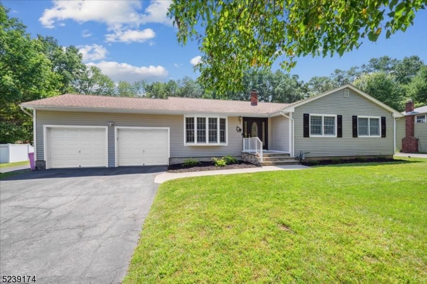 Abundant Space Inside & Out in a Great Area! Nestled on just over half an acre of manicured property, this updated 4B, 2Bth expanded ranch features a desirable and open single-level floor plan filled with gleaming hardwood floors, recessed lighting, and more throughout. Everything you need is located nearby, including stores, restaurants, parks, and top schools with I-80, Rt. 46 and Rt. 206 in close proximity for effortless commutes. You're greeted by a welcoming front porch and foyer that lead you and your guests into a spacious living room with bay window, crown molding, and direct flow into a formal dining room with wainscoting detail and plenty of space. The kitchen boasts classic white cabinetry and appliances, and adjacent you will find an airy and sizable family room with large windows offering panoramic views of the extensive backyard. Outside is a shady covered deck with a cozy pergola that can be accessed from the dining and family rooms, and an enormous and flat backyard beyond with endless space for BBQs, gardening, or playing games. Down the hall are 4 generous bedrooms with large closets and ample natural light, including a primary with a full en-suite bathroom. A beautiful full hall bathroom has a stone-topped storage vanity and tub/shower combo. There's a laundry room conveniently set up on the main floor and an attached 2-car garage is off the living room, while the unfinished basement houses utilities and lots of open space for endless possibilities.