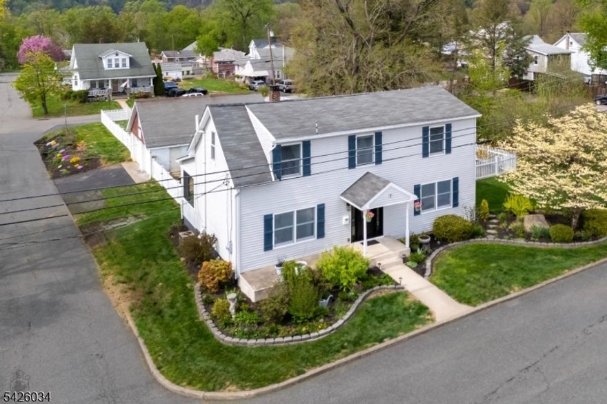 Welcome home! This charming, completely updated Colonial, located on a quiet, statuesque street, is ready for you. A warm front porch greets you as you enter an open-concept foyer filled with natural light. Notable features include a sunroom, first-floor laundry, newer flooring and a fresh coat of paint! The owners have thoughtfully renovated this home with elegant modern conveniences while preserving its original majestic character. With a remodeled bathroom and a fully renovated kitchen w/ quartz countertops, marble backsplash & breakfast bar,  this home is move-in ready. There is plenty of space to relax and enjoy the serene backyard from the NEW TREX DECK. It is fully fenced in with new vinyl fencing for that extra touch of privacy.   In addition to cosmetic upgrades, the property includes over $120,000 in structural, mechanical, and exterior enhancements. Key improvements include: Newer roof and a new front door, Anderson Windows and French patio doors (a $60,000 investment), and a newer hot water heater and humidifier. Take advantage of the newly replaced driveway leading to a 2 CAR DETACHED GARAGE with a freshly poured concrete floor. Brand new garage doors and windows (black exterior/white interior) included with the sale for the new owner to install. This is an outstanding opportunity to own the home of your dreams.