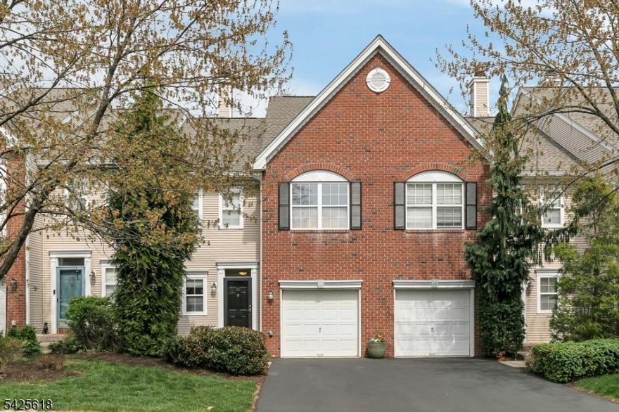 Welcome to this beautifully maintained two-bedroom, two-and-a-half-bath townhome with refined living and a finished walkout basement nestled in one of the Hills' most coveted townhome communities, Hamilton Woods. A gracious foyer sets the tone, opening to a two-story family room that is drenched with natural light and offers views of the wooded backdrop. Honey-stained wood flooring graces the first level, adding warmth and character to every room. A tumbled marble powder room completes the first floor. The eat-in kitchen opens to an expansive (23x16) Bellari-built AZEK TimberTech deck a great space for entertaining or enjoying morning coffee. A separate dining room creates a seamless flow for hosting guests in style. Upstairs, the primary suite impresses with a cathedral ceiling, walk-in closet, and a full bath. The second bedroom is bright and versatile, ideal as a guest room or home office. A second-floor laundry room adds the everyday convenience today's buyers appreciate. The finished walkout lower level serves as a true third level of living, with flexible space for a home office, media room, and more, along with plenty of storage. A private patio opens directly to the wooded setting, providing a quiet place to unwind or entertain. Residents enjoy all Hills amenities including two pools, a gym, pickle ball, and more. It is served by nationally ranked Bernards Twp. (Basking Ridge) schools. Guest parking area is nearby. This is a rare opportunity not to be missed.