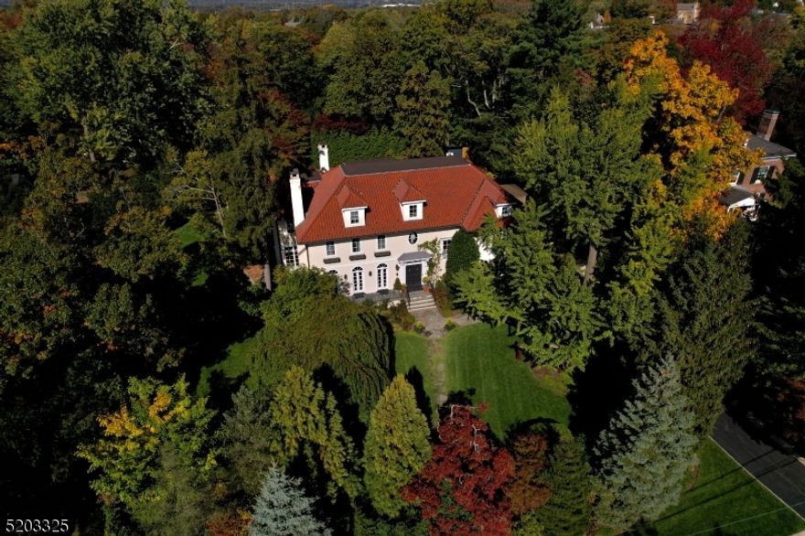 Breathtaking custom colonial built by Dixon Peer nestled on .75 acres.  This sun-soaked gem features gleaming hardwood floors, abundant windows and an expansive open floor plan  Formal reception rooms and an oversized office/library with fireplace, gives way to the heart of the home with a spacious kitchen, and fireside family room.  Open view to picturesque gardens with a bluestone patio, spacious salt waater heated pool and new outdoor pergola and kitchen  Only .8 miles to town.