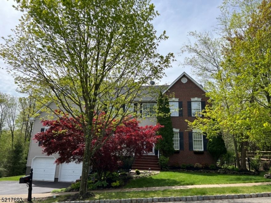 Presenting the largest model in desirable Hunters Ridge section of Roxbury. This beauty is a decorator's dream & features 5 BEDROOMS, 3 FULL BATHS, grand two story foyer entry, spacious & elegant formal living & dining rooms & two story family room with gas fireplace. Gourmet kitchen features stainless steel appliances, including a 6-burner Garland stove, large granite center island & sliders that lead to private, entertaining-sized deck/tree lined fenced yard.  Off the kitchen is a rare find - a 20 x 19 media/great room with pool table included. Home office/ bedroom on first floor + a full bath make a great guest suite. Ascend to the second level and experience the beautiful primary bedroom complete with en suite, huge walk-in closet, double closet & linen closet.  There are 3 additional spacious bedrooms, plus a main bath on the second floor. The second level hallway overlooks the family room. The full basement is conveniently accessible through garage and is ready for finishing. Presently, perfect for storage, and has a work shop room. ROOF IS ONLY 2 YEARS OLD. ALL PUBLIC UTILITIES and a commuters dream--minutes from routes 46, 10, 80. A must see!