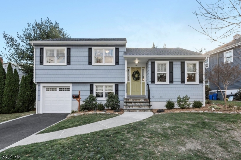 Welcome to this beautiful split-level home in the charming town of Bloomfield, NJ! This home has been thoughtfully updated with modern touches and features that make it truly move-in ready. Inside, the bright and inviting living room leads you into the updated kitchen, complete with a center island & stainless steel appliances, perfect for entertaining. The ground level offers convenience with a laundry room, half bath, and family room, along with direct access to the attached garage. Upstairs, you'll find three spacious bedrooms, including a primary suite with a private ensuite bathroom, as well as a second full bathroom. The fully finished basement adds even more living space, featuring utility & storage closets, built-in cabinetry. includes built-in workspace/ desk. Step outside to the patio that overlooks the oversized backyard, providing ample space for all your outdoor needs. Key updates include a new roof (2023), central air (2018), Anderson 400 Series and doors (2018), major renovations (2018), and a finished basement (2021). Hardie plank siding. Additional features include a newer water tank, boiler, fresh paint, and new interior doors. This home truly has it all don't miss the chance to make it yours!