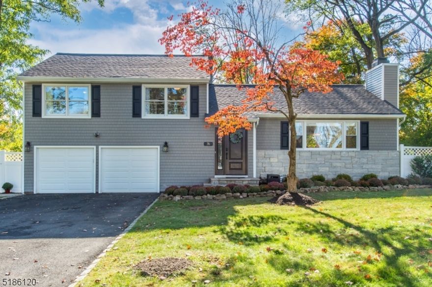 Exceptionally renovated and deceptively large, this stunning Burnham Park area home is just a mile from the heart of Morristown. Significant improvements within the last five years include new siding, roof, driveway, AC, furnace, hot water heater, landscaping, privacy fencing, kitchen, and much more make it completely move-in ready. The renovated kitchen offers new granite countertops and marble backsplash along with stainless steel appliances and access to the large deck with breathtaking views. The light-filled dining room and large living room have newly refinished hardwood floors and a wood-burning fireplace, completing the first level. The upstairs has three bedrooms including a primary bedroom with an en-suite bathroom and custom walk-in closet. The renovated lower level offers a half bath, oversized laundry room, mud room leading to the two-car garage, family room, office space, home gym and an ideal guest space complete with private rear entrance. The outdoor space offers a large, private and fenced-in backyard with approximately 1,000 sq. ft. paver patio and walkway, perfect for entertaining. Near the heart of Morristown, convenient to Whole Foods, multiple parks, and commuter pathways, this is the ideal place to make your home.