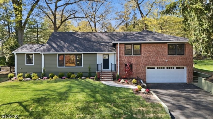 First impressions only tell part of the story! This completely renovated split-level in Upper Gregory offers over 3,300 sq ft of beautifully designed living space across four finished levels. The oversized living room features a gas fireplace, custom built-ins, and a picture window overlooking the manicured front lawn.The gourmet kitchen includes custom cabinetry, Thermador appliances, quartz countertops, and a center island with seating for four, flowing seamlessly into the dining area, family room, and a sun-filled three-season room with access to the backyard patio.The second level offers three bedrooms, including a potential in-law suite with two walk-in closets and an updated bath with double sinks and tiled shower. A hall bath and laundry complete this level. The third level is dedicated to the private primary suite with a spa-like bath, soaking tub, double vanity, walk-in shower, and large walk-in closet.The lower level features an additional bedroom, office with separate entrance, wet bar, and access to the two-car garage. The finished basement offers a recreation room, gym, and second laundry area. If you're looking for a truly CUSTOM HOME, then WELCOME HOME!!!