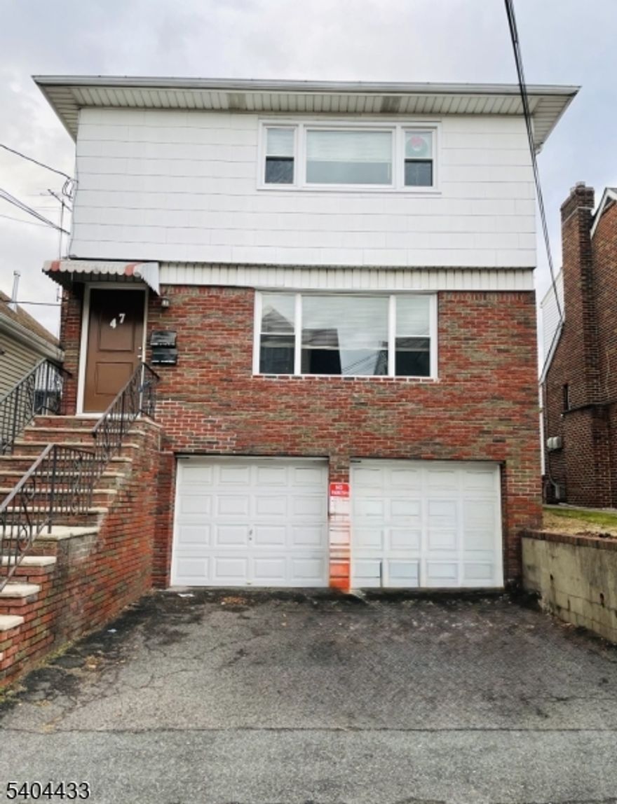 TWO FAMILY,1st.Flr.6 rms,3bedrms,1bth.Mod.Kit.(gas stove,mirowave,dishwasher,refrigerator)H/W flrs,BI Wall A/C.Private laundry w/Washer,Dryer,private storage rm.Garage entrance into home.REQ.Good Credit,Proof of Income. NO PETS.NO SMOKING,USE OF REAR YARD(MUST CLEAN UP).