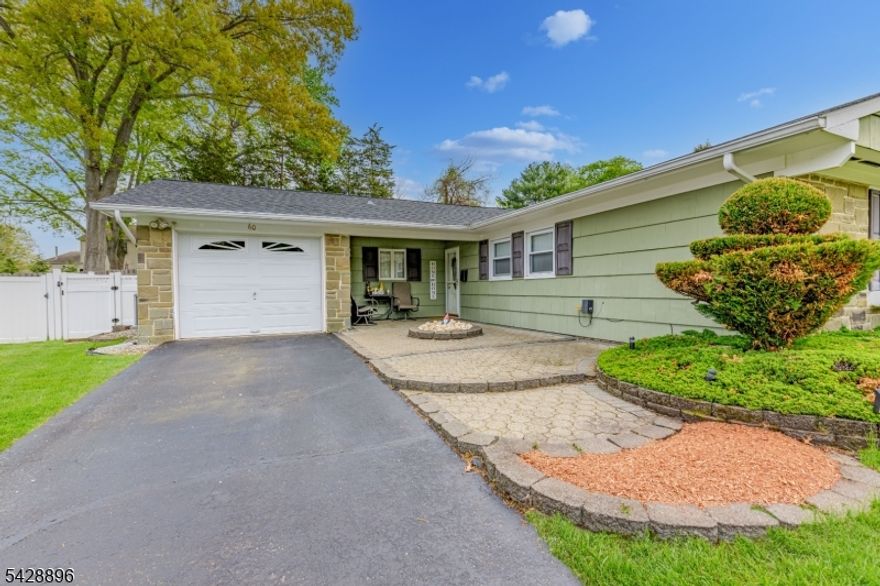 Move-in condition: Home is nested in the highly desirable "F" section of Strathmore.  This impeccably maintained ranch represents the gold standard of turn-key living. The open-concept design is anchored by a sun-drenched living area featuring four floor-to-ceiling windows (overlooking the yard & aboveground Pool) and premium, newer laminate flooring throughout. The chef?s kitchen is a standout, featuring granite countertops, stainless steel appliances, and high-durability, double-sided, waterproof flooring. A sliding glass door leads you from the kitchen to a professionally landscaped, fully fenced backyard retreat. Total peace of mind with a newer roof, central A/C, water heater, and upgraded electrical service installed in 2016. Commuter?s Dream: easy access to NYC-bound trains and buses, the Jersey Shore, local entertainment, and Aberdeen?s highly-rated school system. Come and see yourself; no second look needed.