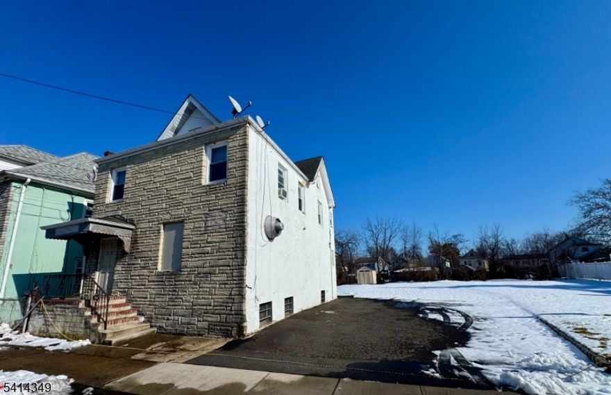 Commercial building located on a double lot in a Residential neighborhood, currently utilized as a House of Worship. Primary value is in the land with potential for subdivision and new residential development, subject to zoning verification, municipal approvals, site plan review, and flood zone compliance. Buyer responsible for all due diligence, including confirmation of permitted uses. Excellent opportunity for investors, builders, or developers.