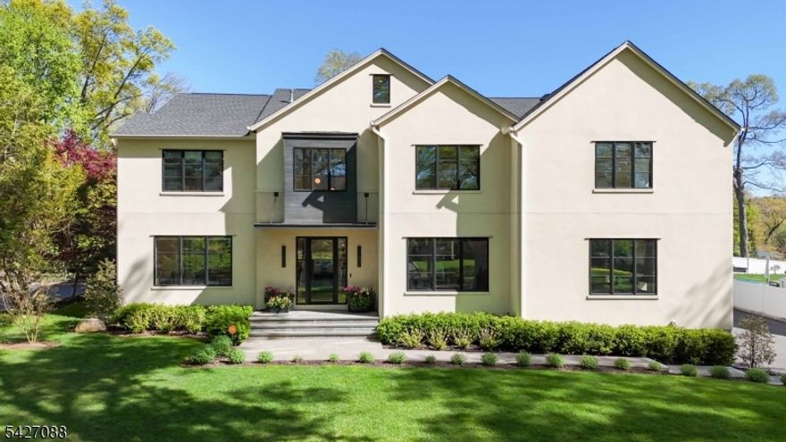 Set on a picturesque half-acre in the heart of the Rolling Hill neighborhood, this stunning custom contemporary offers 4 fin lvls,7 bdrms, 7 full  & 1 half bath, blending the ultimate in chic design w/exceptional functionality.Sun-drenched interiors showcase an open floor plan,high ceilings throughout, cust white oak flooring & striking, cust metal staircase balusters. The chef's kitchen features Sub-Z/Wolf appl, recessed cabinetry,seamless quartz countertops, & an oversized center island w/seating for six.Conv loc off the kitchen is a walk-in pantry & butler's pantry w/ an addtnl dishwasher & wet bar. Designed for modern living, this home includes TWO laundry rooms (one with dual washer/dryer sets) a temp-controlled wine room & a lower level complete w/ custom bar/entertainment area, high-end gym, full bath & an additional bedroom.The second level boasts a luxurious primary suite w/ two oversized custom walk-in closets & a spa-like onsen-style bath w/soaking tub & a motorized toilet/bidet.Four addtnl lrg bdrms w/ walk-in closets, 2 more en-suite baths & a Jack-n-Jill bath finish this lvl.The outdoor living space is UNMATCHED complete w/ a 20x40 heated pool featuring an integrated spa, wifi-enabled controls,an auto cover, full-length sitting ledge, smooth coping surround, a lrg lounge area & a pool house, creating your own private resort. Don't miss the full-house gen and 2-car charging stations!Too many exceptional details to list! This spectacular custom home is a MUST SEE!