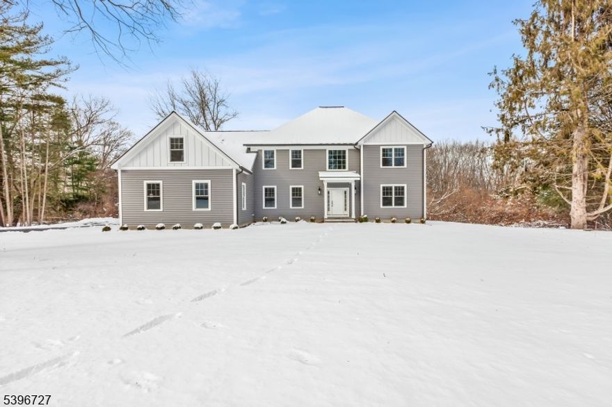 Introducing a stunning new construction home offering over 4,000 square feet of thoughtfully designed living space. This exceptional residence features 4 bedrooms and 3.5 baths, set on a 1.6 acre lot just minutes from downtown Chester.A dramatic two-story foyer welcomes you into an open, light-filled floor plan highlighted by soaring ceilings and elegant wide-plank hardwood floors throughout. The chef's kitchen is a true showpiece, featuring a large center island with Calacatta countertops and top-of-the-line BOSCH appliances. The space flows seamlessly into a sunlit eat-in area and an inviting family room with a cathedral ceiling and a cozy gas fireplace. Step out onto the deck off the kitchen perfect for outdoor dining and entertaining. Just off the foyer, a private study or home office with French doors provides an ideal work-from-home space. Upstairs, the expansive primary suite offers a walk-in closet and a spa-like bath with double vanities, a soaking tub, a stall shower, and elegant Calacatta countertops. Three additional bedrooms include one with an ensuite bath, along with a generous bonus room ideal for a game room, media space, or recreation area. Designer lighting from Chester Lighting enhances the home's sophisticated ambiance. Additional highlights include a heated three-car garage equipped with an electric vehicle charger. This exceptional property combines luxury, comfort, and modern convenience and is truly a must-see.