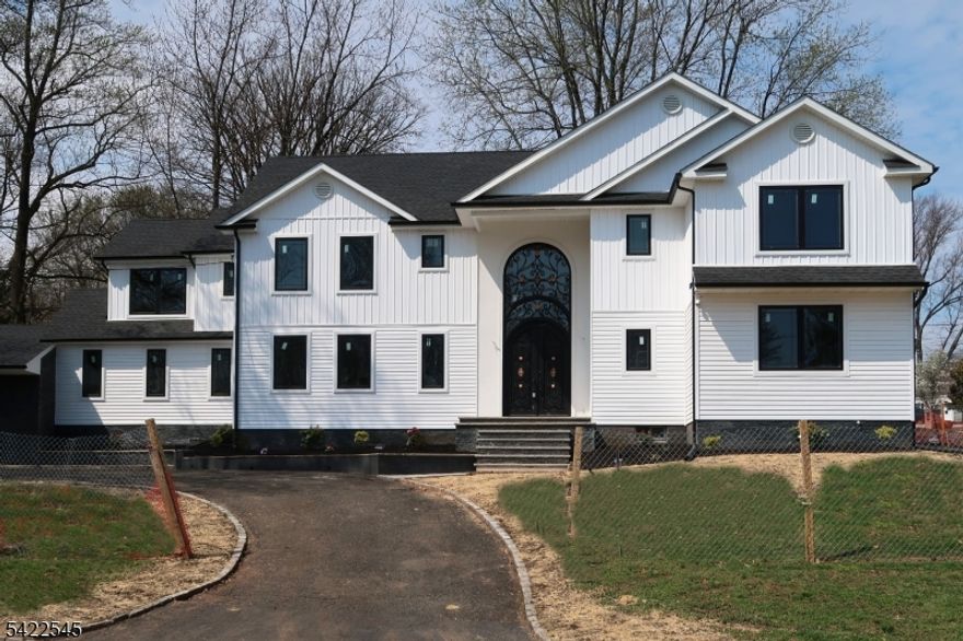 Don't miss this exceptional opportunity for a luxury home in highly desirable Mountainside! This 5 BR 4.5 BA home, newly constructed on existing foundation by renown builder Grand Home Investments offers approx. 3650 sf of refined living space on 3 levels. The Exterior package is completed and you have limited time left to collaborate with the builder and customize some interior finishes & fixtures. Enter the Main Level through a stunning two-story Foyer. Entertain in grand style in a two-story Fam. Room, a formal Dining Room with Tray Ceilings and a generously sized Living Room. Enjoy everyday meals in an Open Concept Kitchen with oversized center island. Guest Bedroom Suite with Full Bath and an Office are conveniently located on Main Level. Upper Level is dominated by a palatial Primary Bedroom Suite with His & Hers Walk-In Closets and a spa-like Bath with freestanding soaking tub and a stall shower. Three more spacious Bedrooms, two Baths and a Laundry Rm complete the Upper Level. Basement will be finished with sheetrock, LVP flooring and recessed lighting. Other upscale features include an attached 2-Car Garage, hardwood flooring on 2 Levels, soft-close Kitchen Cabinetry and many more. Absolutely unbeatable location is within a short walk to an Express Bus to NYC, 10 min drive to Westfield Train station, steps away from Route 22, and a short drive to Watchung Reservation. List of fixtures and finishes available upon request. INTERIOR PHOTOS ARE OF PREVIOUS BUILDS BY GHI