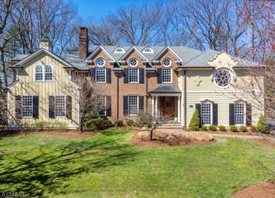This meticulously cared for 7BD/5.5BA residence home is certain to turn heads with its remarkable style, beautifully landscaped half-acre grounds, elevator accessibility and excellent Short Hills location. Built by architect Thomas Baio, the 6,800SF stunner is filled with cherry floors, substantial wainscoting, crown molding and designer lighting. Perfect for entertaining and comfortable daily life, the main floor includes a grand entry, formal living and dining rooms, powder room, a vaulted family room and masterful culinary kitchen with a breakfast room, command center, storage pantry and butler's pantry. A bedroom suite and another bedroom perfect as a home office complete the level. Above, the palatial owner's retreat dazzles with a sitting room, private deck, en suite spa bath, WIC and access to a laundry room with cedar storage. Another suite with a semi-private bath, two bedrooms that share a Jack-and-Jill bath and a fifth bedroom provide luxurious accommodations, while a regal library and upper-level office provide exceptional work-from-home space. The lower level delivers a sprawling rec room, bath, gym, wine room and closets, while attic provides more storage space. Zoned HVAC, two water heaters, security cameras, 24KW generator, sump pump and integrated sound system. Attached (heated) and detached garages. Breathtaking facade. Outstanding location close to local golf courses, Mall at Short Hills, South Mountain Reservation, highways and train stations.