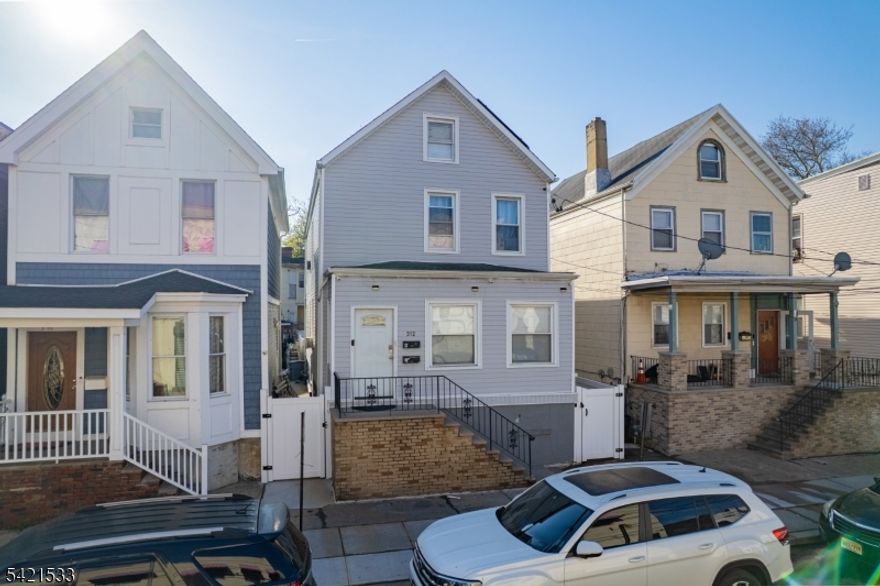 Well-maintained legal 2-family home offering 2,439 sq ft of living space in a convenient Elizabeth location. Unit 1 features 3 bedrooms and 2 full baths, while Unit 2 offers 3 bedrooms and 1 full bath, each with spacious living areas and well-sized rooms. The property also includes a finished basement and a finished attic, providing additional flexible living space. Located approximately 0.8 miles from the Elizabeth Train Station, with close proximity to shopping, dining, parks, and major roadways.