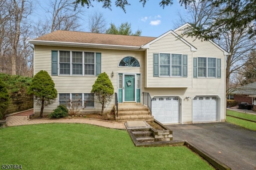 The perfect home in a lakefront community! Well-maintained Bi-Level home boasts  4 bedrooms, 2 1/2 bathrooms, an attached 2-car garage, and a private back yard just thirty miles west of Manhattan. Nestled on the desirable community of Indian Lake, on a tree-lined dead end road, this move-in ready home features vaulted ceilings, hardwood floors, abundant natural light, and tree-top views from the deck. The open layout on the main level includes a large, sun-filled living room, a formal dining room, and a bright eat-in kitchen with a skylight and generous cabinet and counter space. Sliding glass doors open to an inviting deck ideal for morning coffee or watching the sunset.  Down the hall is the primary bedroom with two closets and a private full bathroom, plus two additional bedrooms and another full bathroom in the hallway. The lower level offers a fourth bedroom, a half bathroom, a large family room, and a laundry room with an outside entrance to the ground-level patio. Enjoy the lake life with beaches, boat slips, and lots of outdoor activities close at hand, along with a train station, well-regarded schools, Interstate 80 and Route 46, a regional hospital, and a bustling downtown with an eclectic mix of shops, eateries, and businesses. PLEASE NOTE: In some GPS street will come as Trail, others as Place.